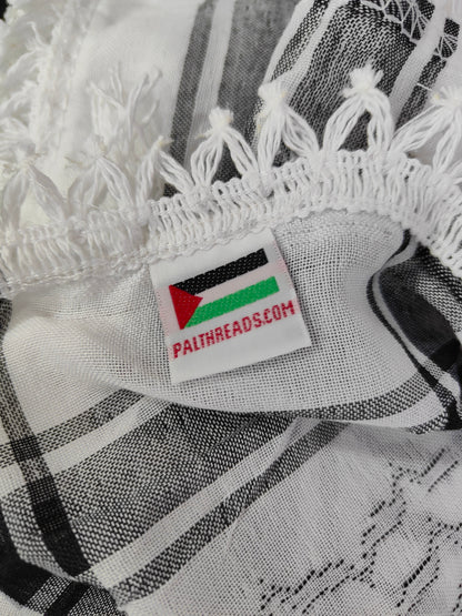 The traditional black and white keffiyeh is proudly made in Palestine and carries the original Palthreads.com label 